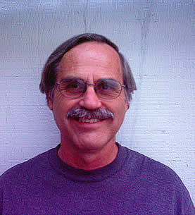 photo of a man with eyeglasses and a moustache