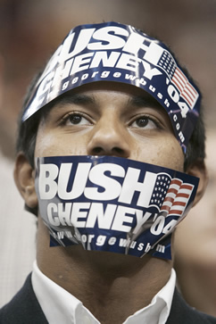 photo of a man wearing bush-cheney 04 stickers on his head and over his mouth