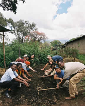 SOS program fellows and their in-country counterparts work together-preparing the soil at a community garden plot. -Sistie Moffitt photo 