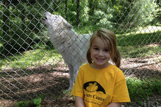 Atka the wolf and a little girl
